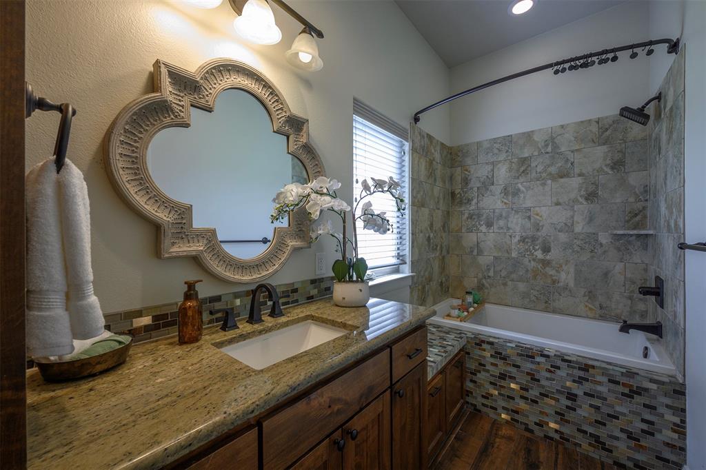 1003 Buckner Road Lipan, TX 76462 - Photo 18 of 31 a bathroom with a sink and a mirror