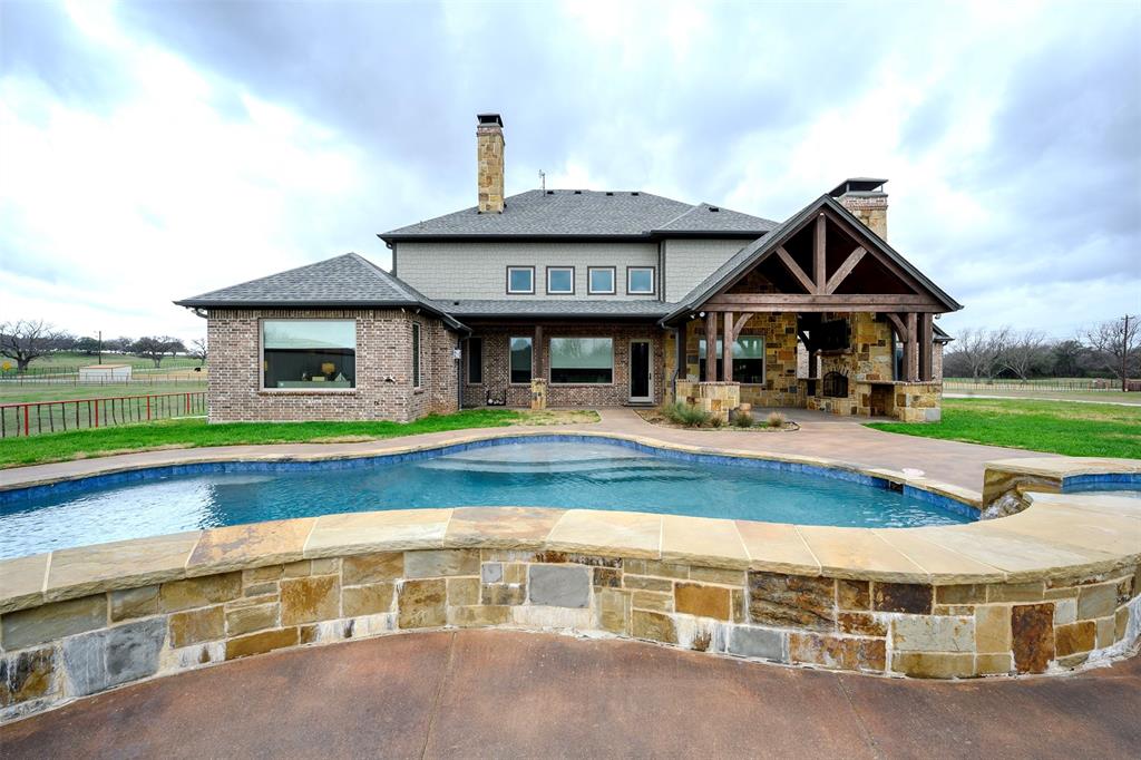 1003 Buckner Road Lipan, TX 76462 - Photo 28 of 31 a view of pool with umbrella and wooden fence