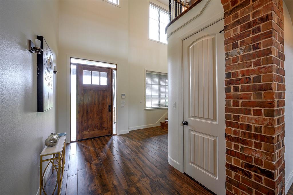 1003 Buckner Road Lipan, TX 76462 - Photo 3 of 31 a view of a livingroom with wooden floor and windows