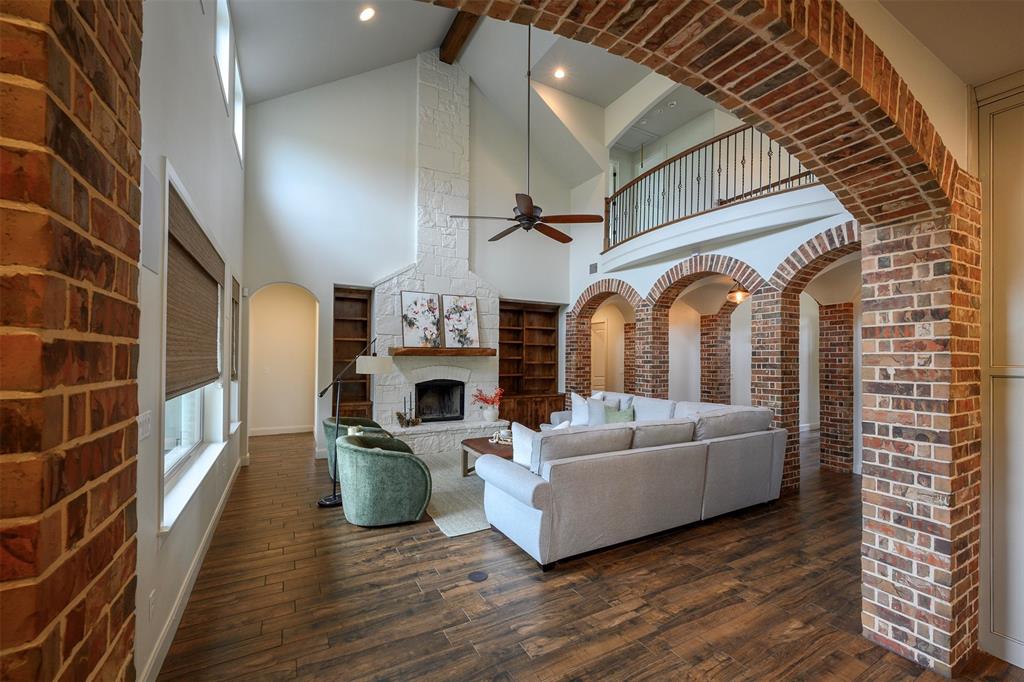 1003 Buckner Road Lipan, TX 76462 - Photo 7 of 31 a living room with furniture and a fireplace