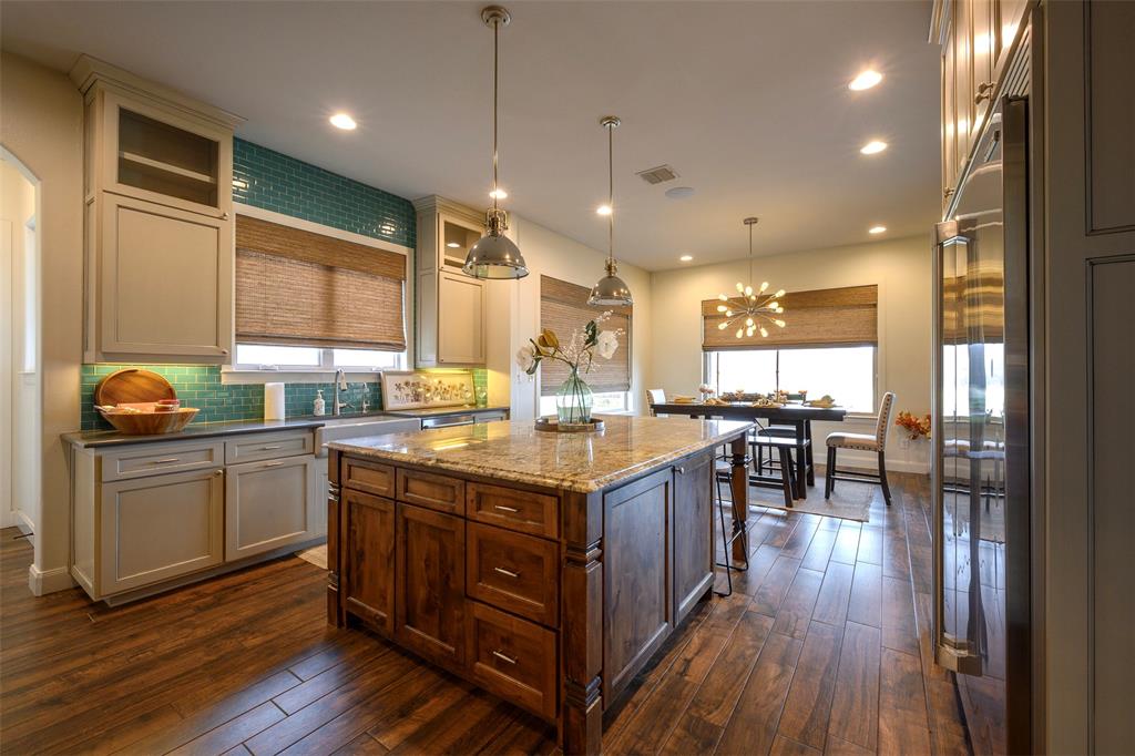 1003 Buckner Road Lipan, TX 76462 - Photo 8 of 31 a kitchen with stainless steel appliances granite countertop a stove and a wooden floors