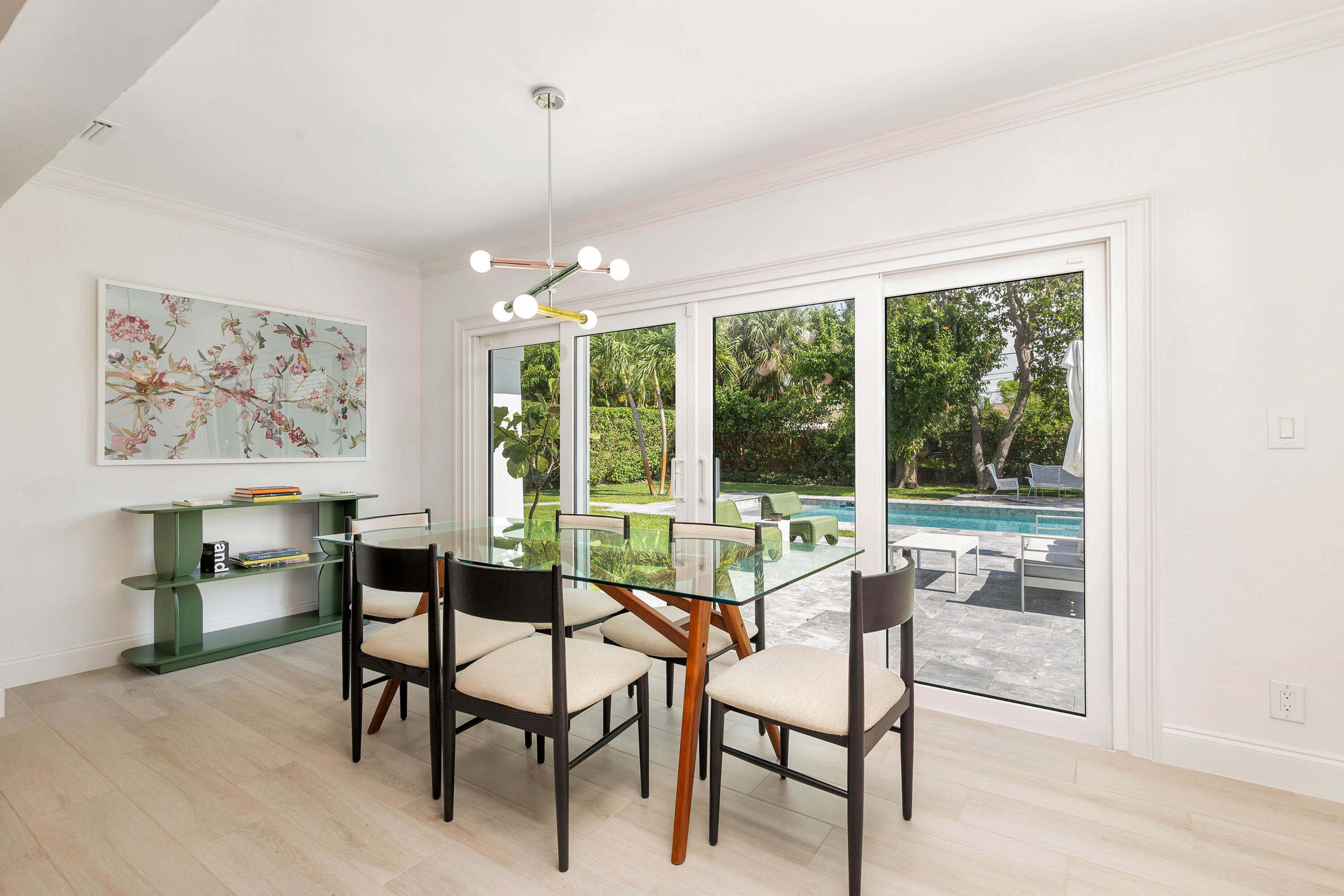 215 Cortez Road West Palm Beach, FL 33405 - Photo 4 of 17 a dining room with furniture a chandelier and a rug
