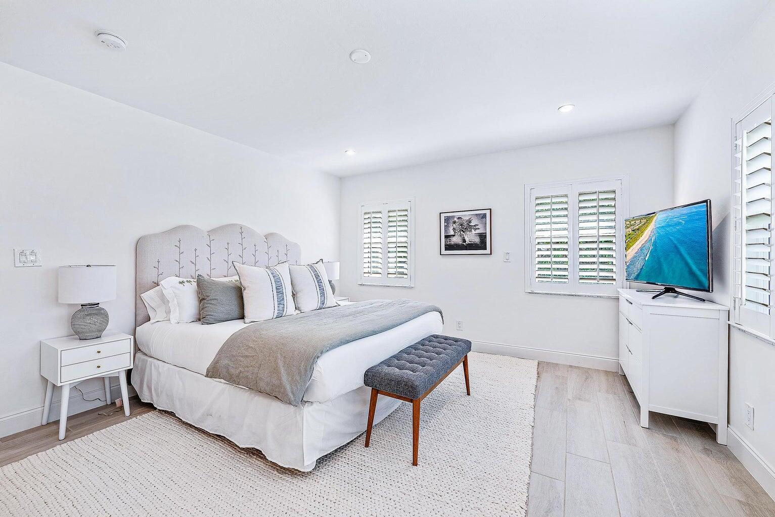 215 Cortez Road West Palm Beach, FL 33405 - Photo 10 of 17 a bedroom with a bed and a flat screen tv