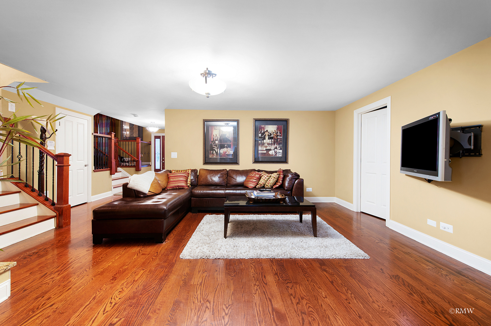 1216 Sable Drive Addison, IL 60101 - Photo 16 of 25 a living room with furniture and a flat screen tv