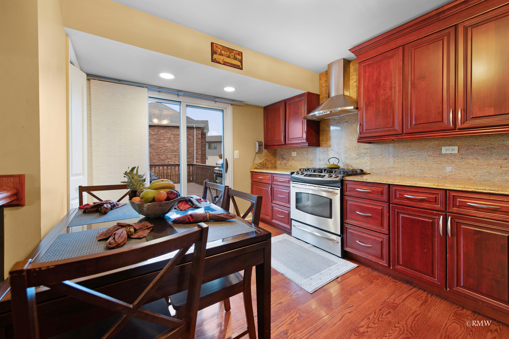 1216 Sable Drive Addison, IL 60101 - Photo 9 of 25 a kitchen with stainless steel appliances granite countertop a stove refrigerator sink and cabinets