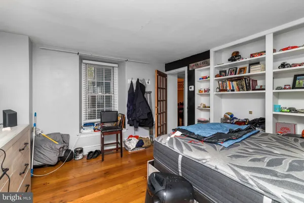 a living room with furniture pool table and a window