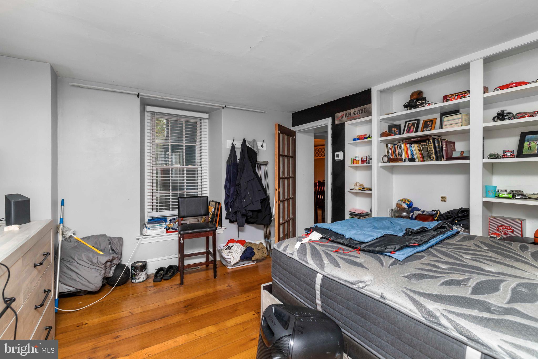 3636 Pine Road Huntingdon Valley, PA 19006 - Photo 12 of 32 a living room with furniture a rug and a book shelf