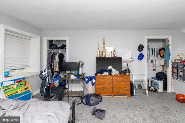 a bedroom with furniture and a bed