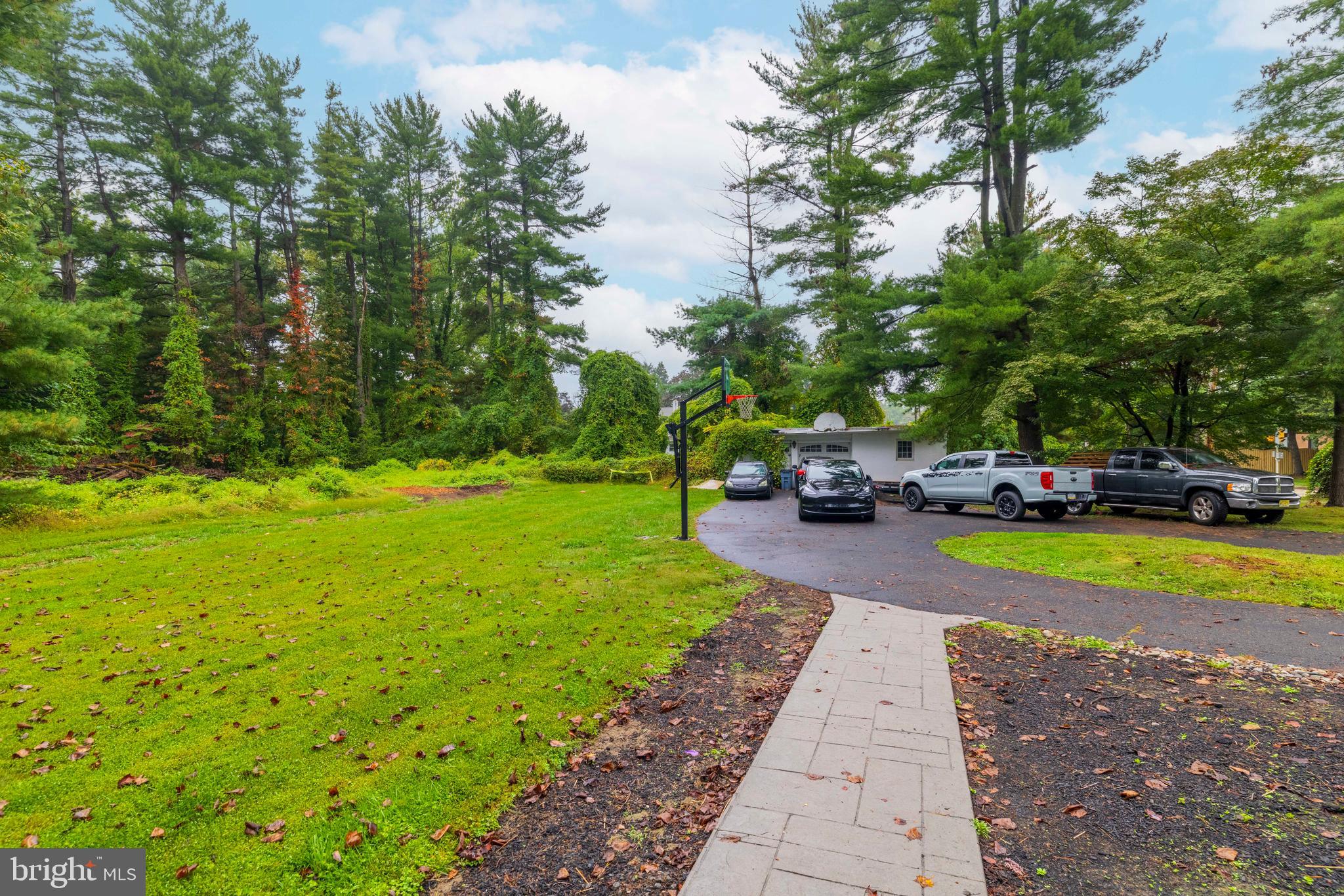 3636 Pine Road Huntingdon Valley, PA 19006 - Photo 22 of 32 a view of a park with lawn chairs with plants
