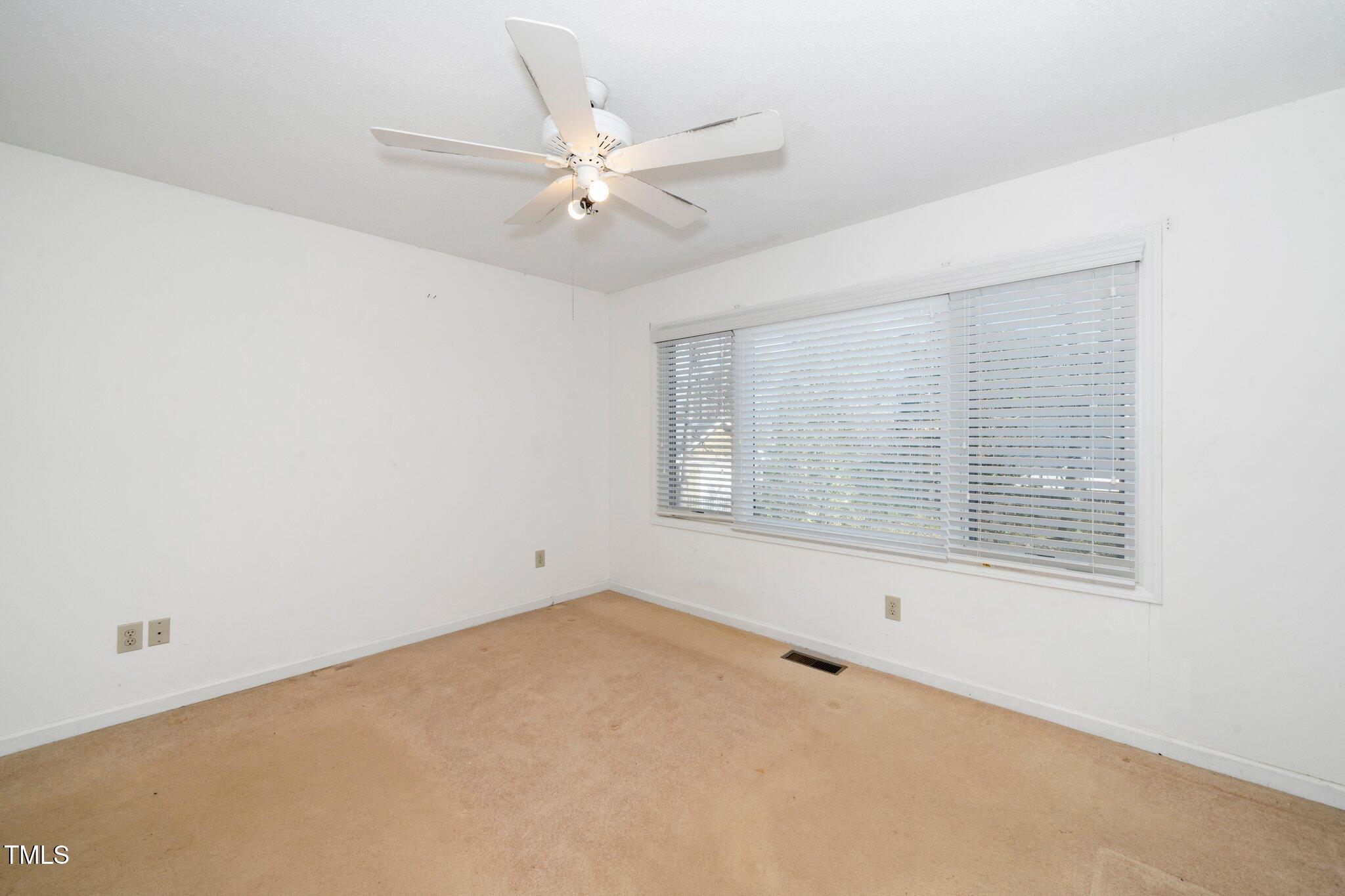 6312 New Market Way Raleigh, NC 27615 - Photo 16 of 31 an empty room with a window