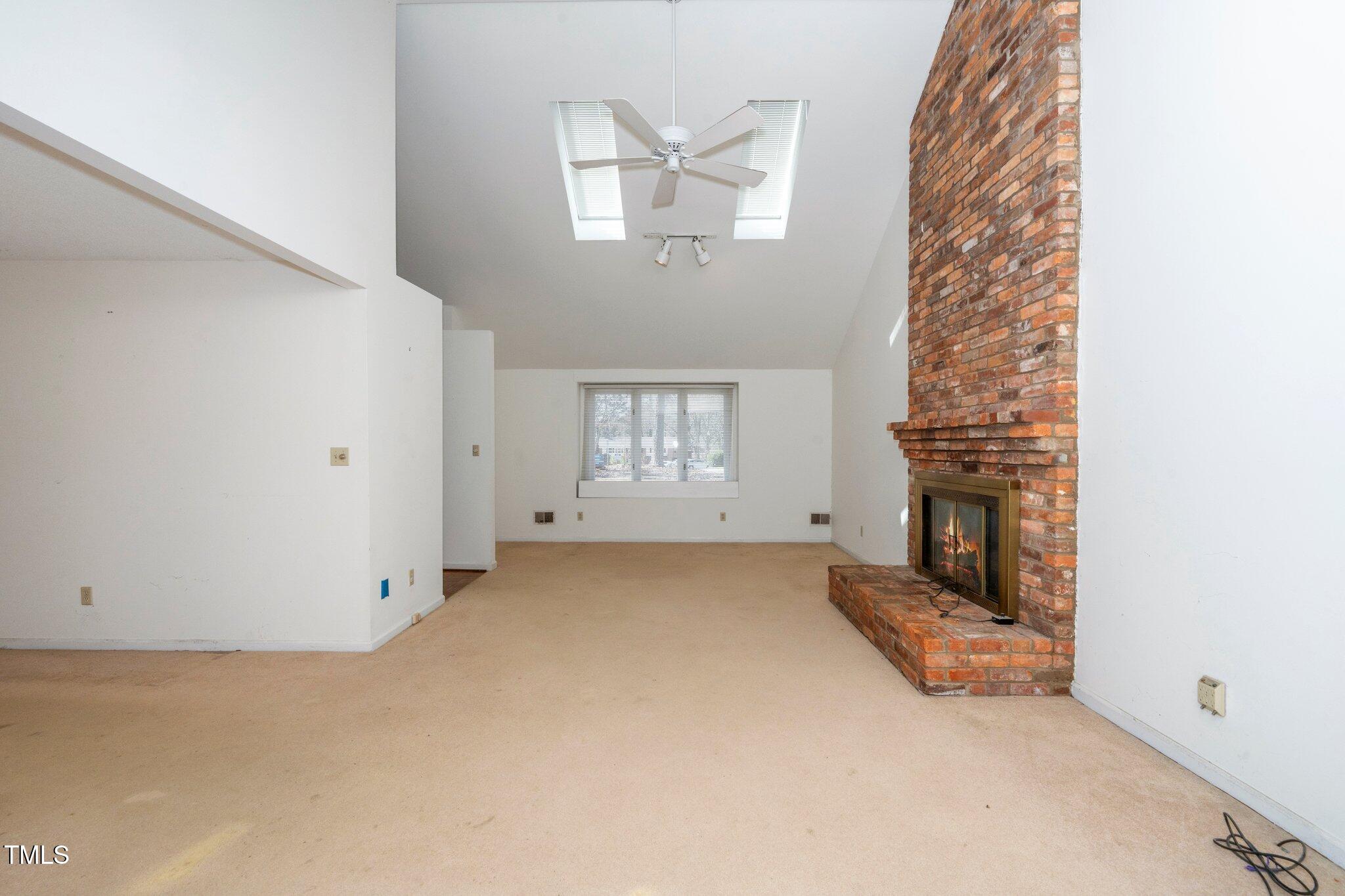 6312 New Market Way Raleigh, NC 27615 - Photo 17 of 31 a view of an empty room with a window