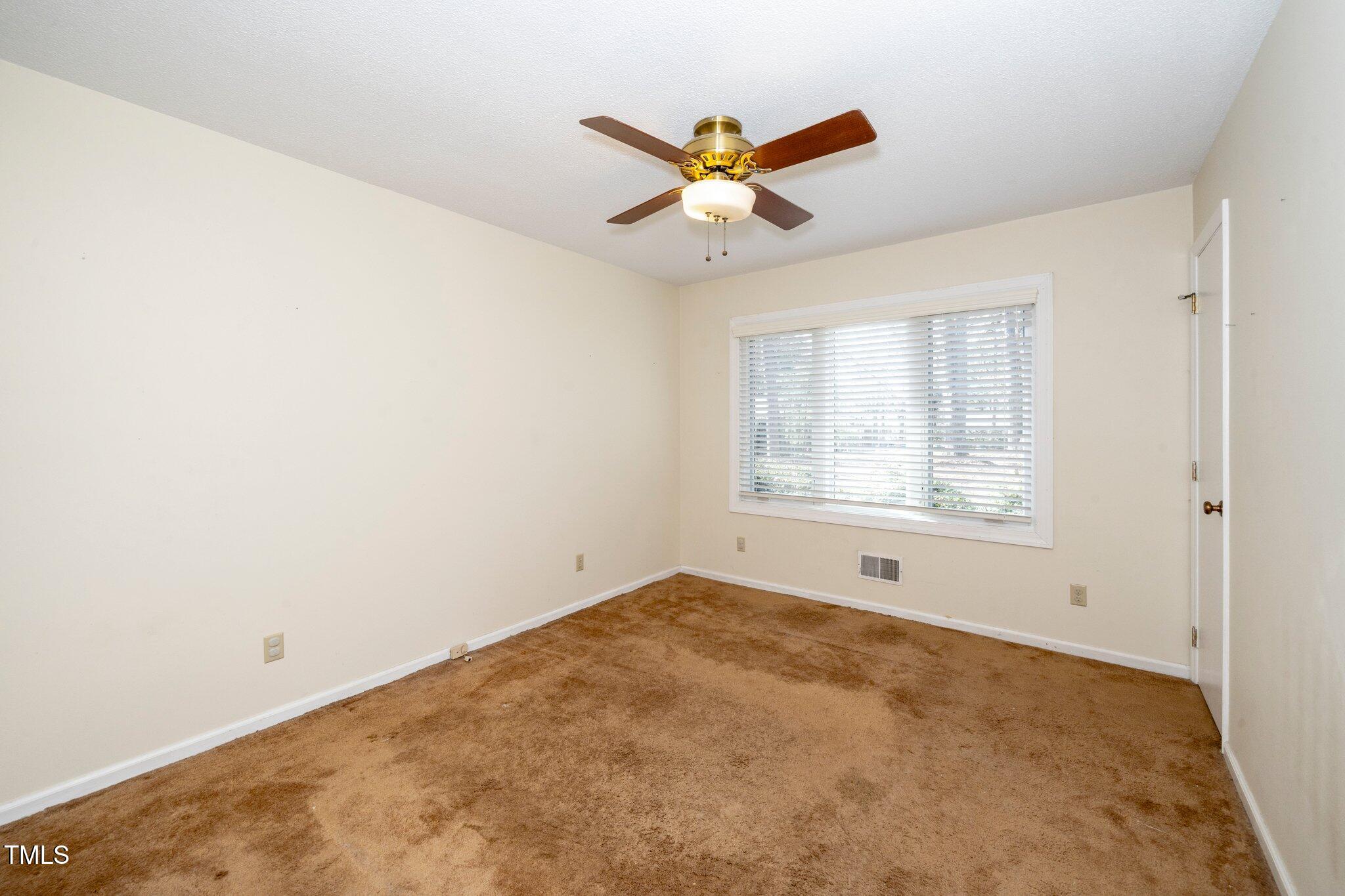 6312 New Market Way Raleigh, NC 27615 - Photo 23 of 31 a view of an empty room with a window