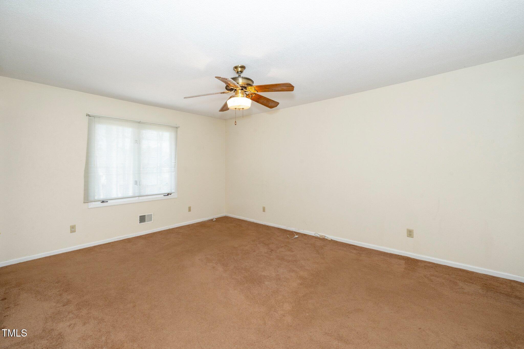 6312 New Market Way Raleigh, NC 27615 - Photo 24 of 31 an empty room with a window
