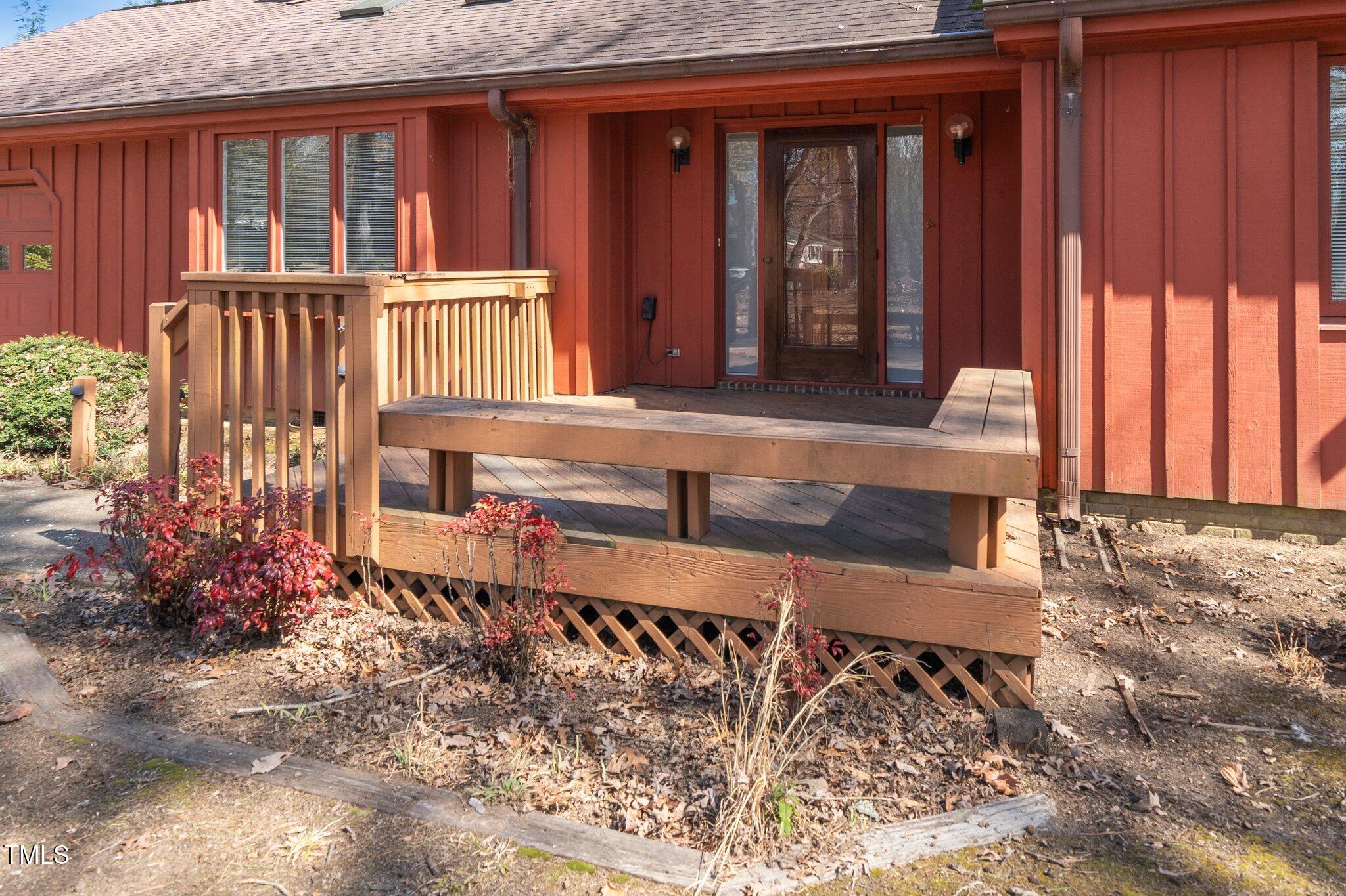 6312 New Market Way Raleigh, NC 27615 - Photo 27 of 31 a view of a bench in the porch