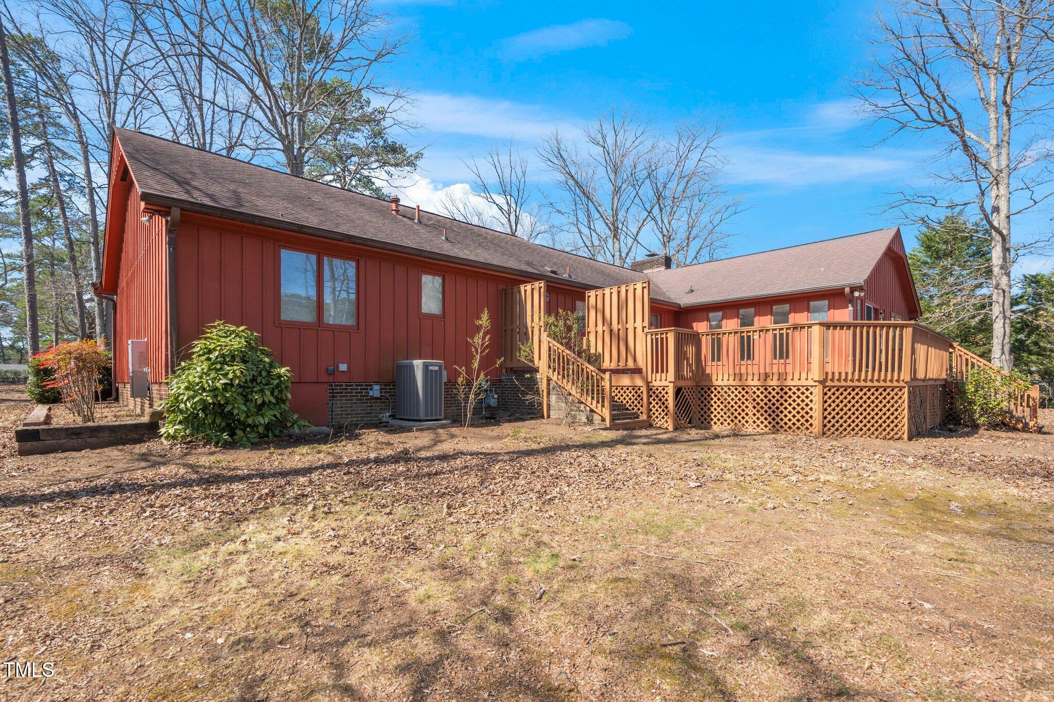 6312 New Market Way Raleigh, NC 27615 - Photo 28 of 31 a front view of a house with a yard and garage