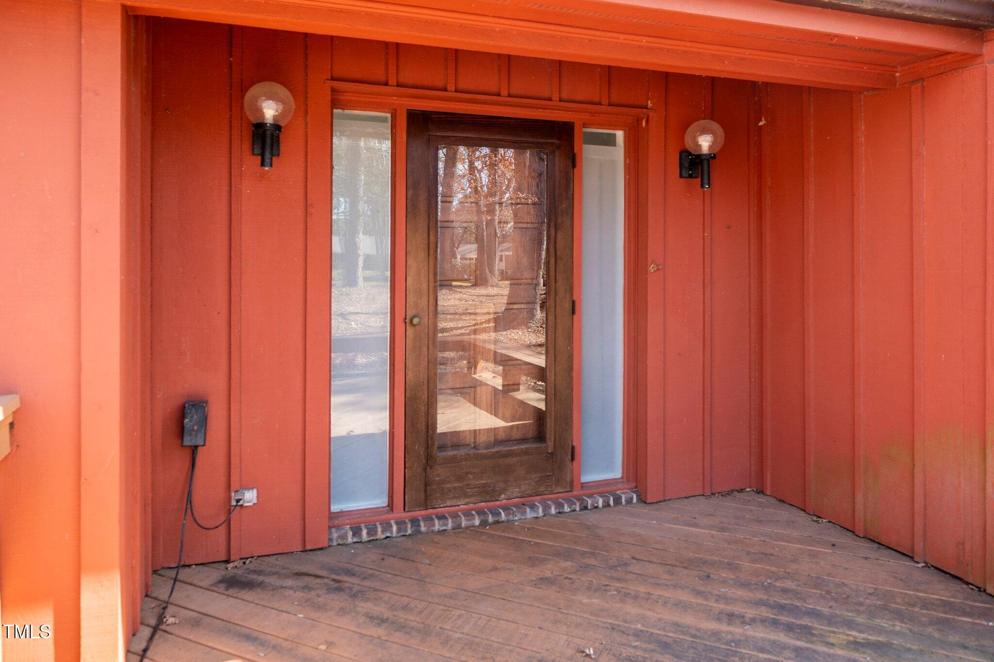 6312 New Market Way Raleigh, NC 27615 - Photo 7 of 31 an empty room with wooden floor and a window