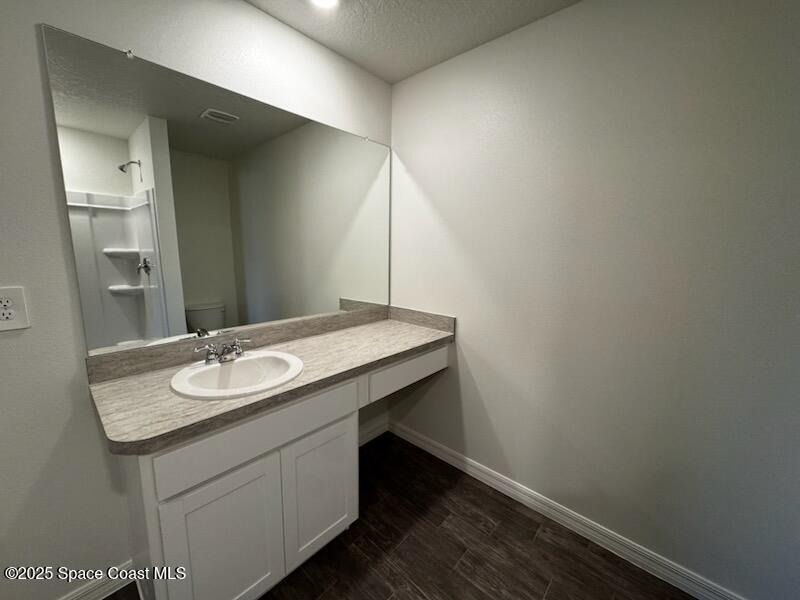 1349 Gibbs Road Southwest Palm Bay, FL 32908 - Photo 6 of 9 a bathroom with a sink and a mirror