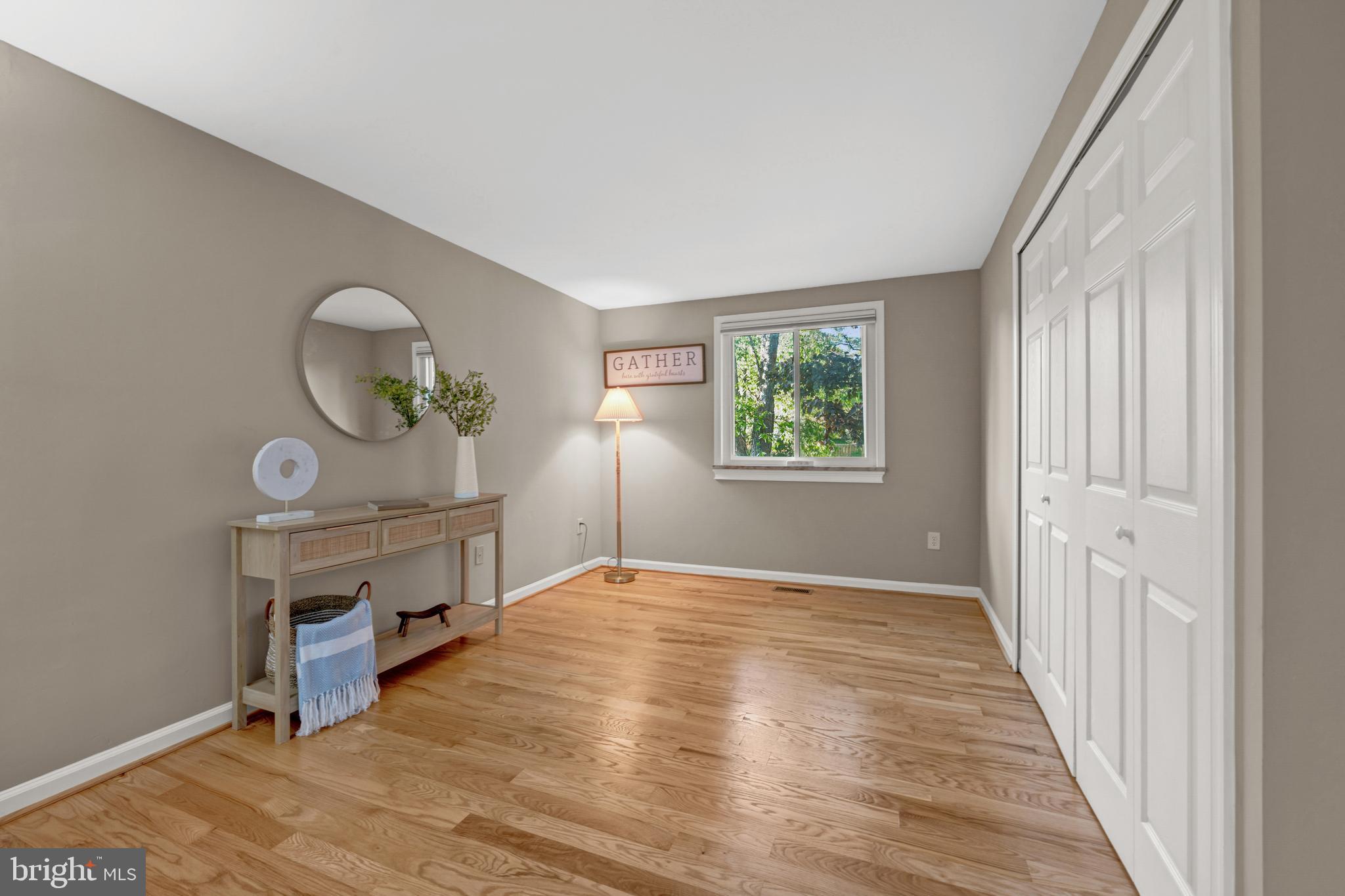 12772 Bradwell Road Herndon, VA 20171 - Photo 20 of 43 a view of livingroom with furniture window and wooden floor