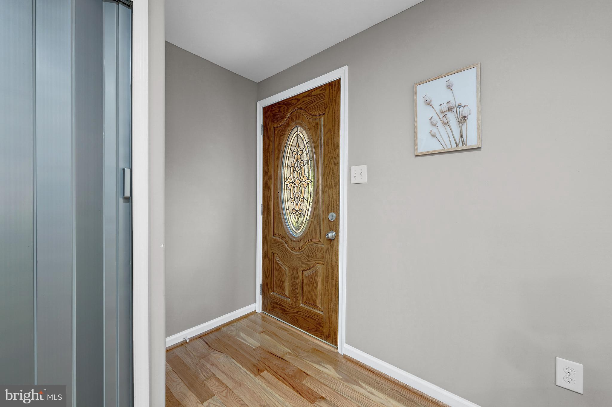 12772 Bradwell Road Herndon, VA 20171 - Photo 4 of 43 a view of front door with wooden floor