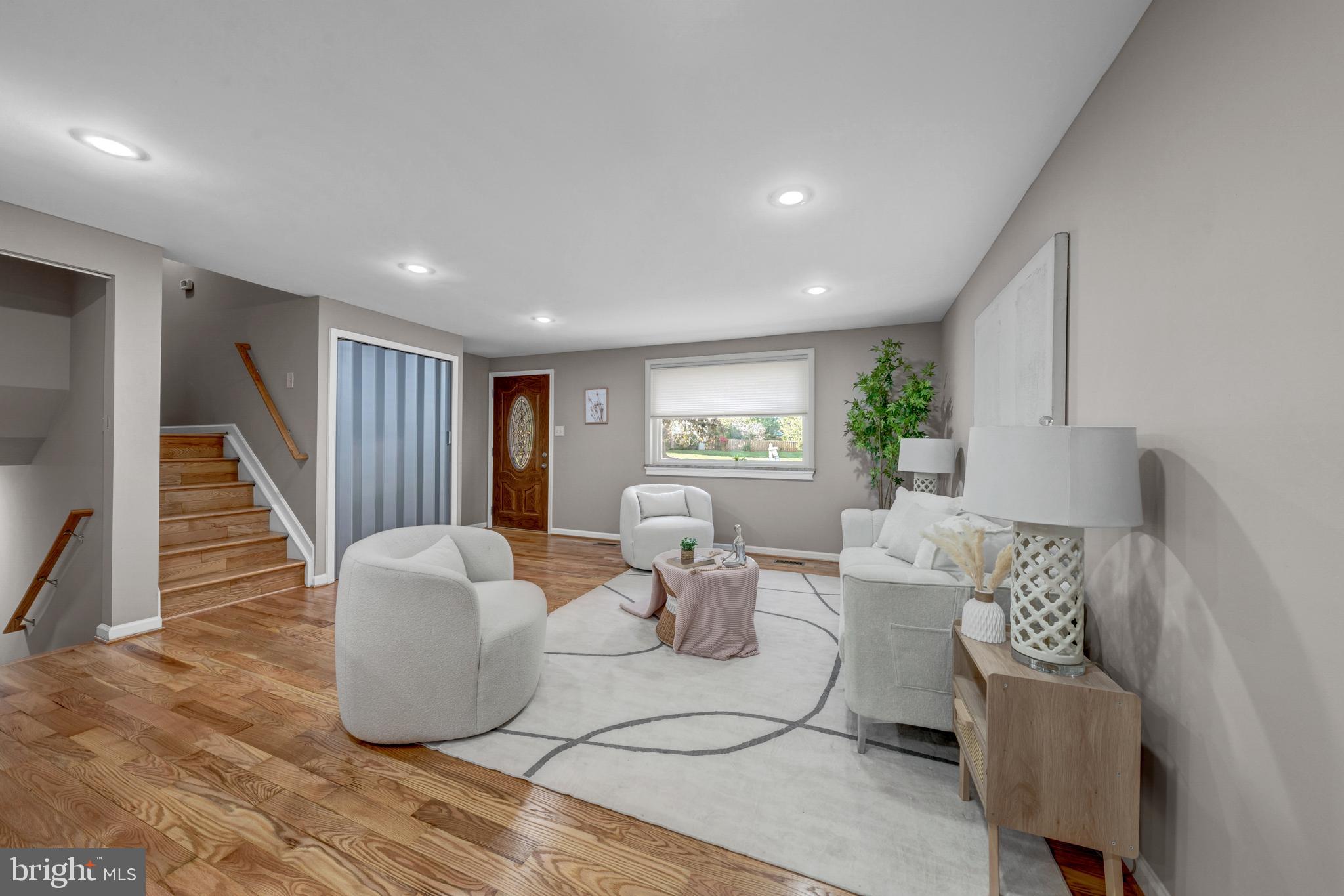 12772 Bradwell Road Herndon, VA 20171 - Photo 8 of 43 a living room with furniture and wooden floor