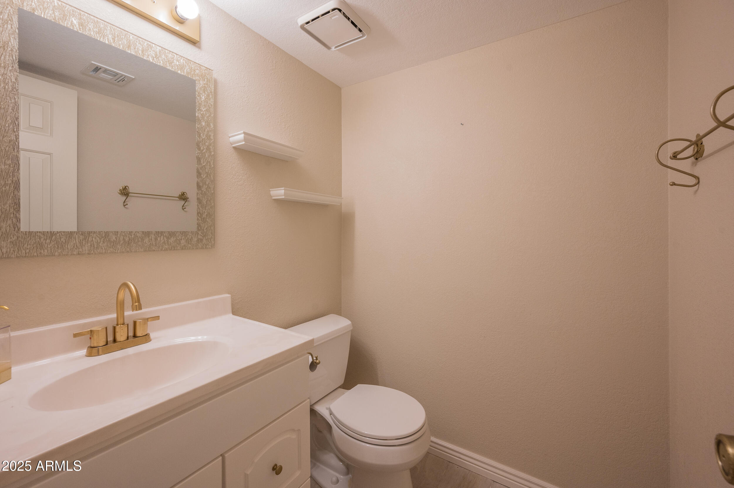 1920 East Maryland Avenue, Unit 31 Phoenix, AZ 85016 - Photo 17 of 43 a bathroom with a sink toilet and a mirror