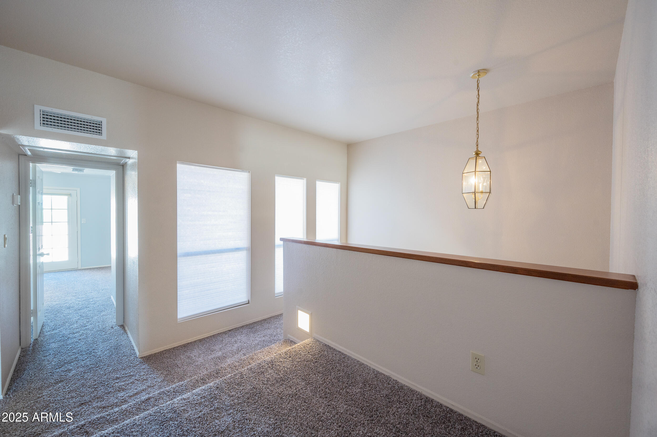 1920 East Maryland Avenue, Unit 31 Phoenix, AZ 85016 - Photo 19 of 43 en empty room with windows and ceiling fan