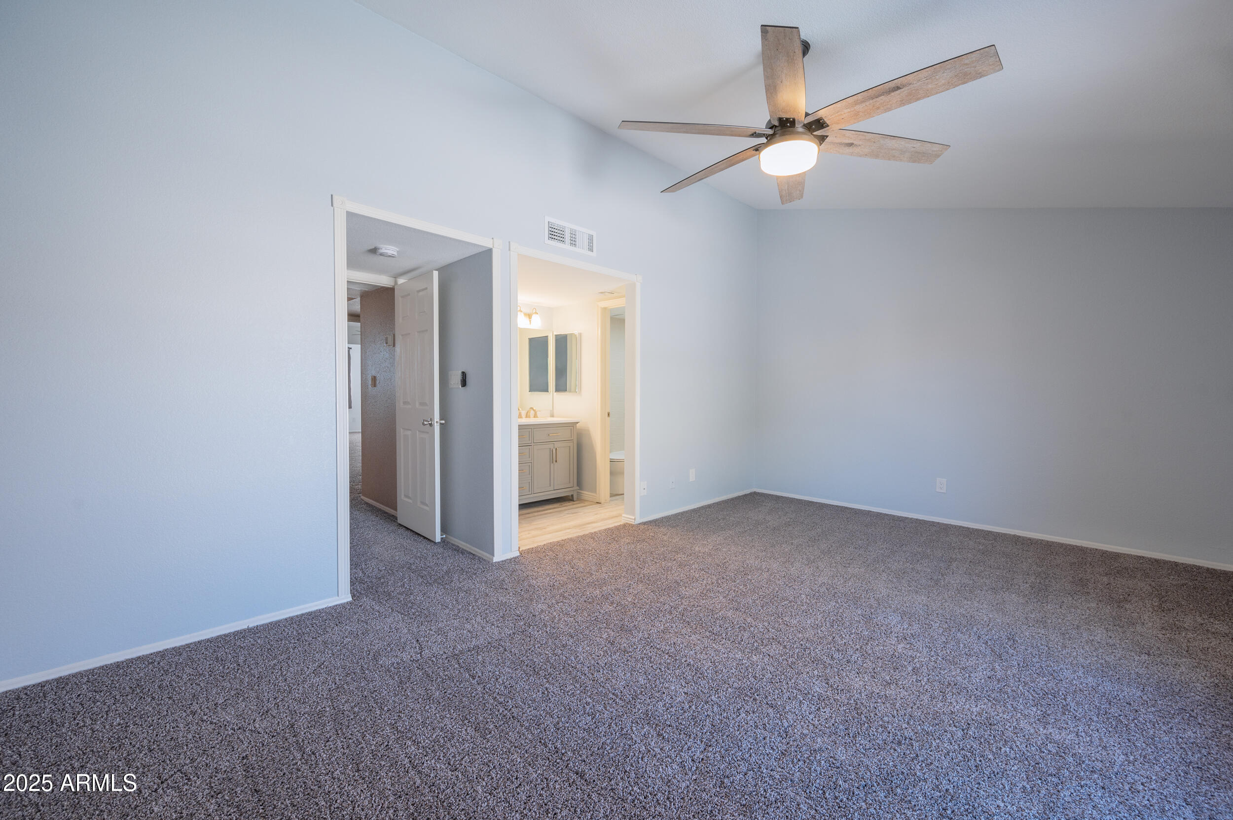 1920 East Maryland Avenue, Unit 31 Phoenix, AZ 85016 - Photo 22 of 43 an empty room with closet and a ceiling fan
