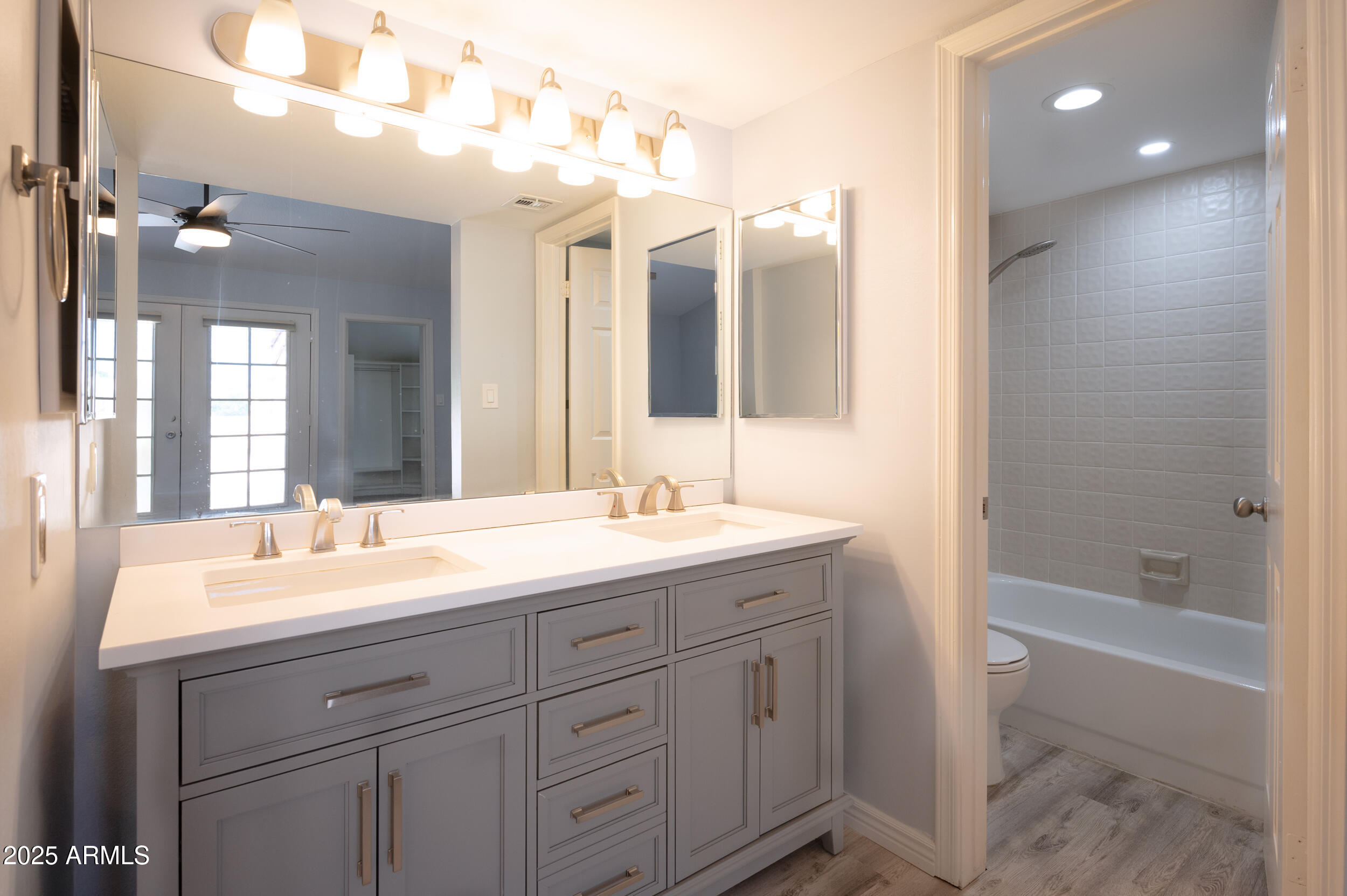 1920 East Maryland Avenue, Unit 31 Phoenix, AZ 85016 - Photo 24 of 43 a spacious bathroom with a granite countertop sink mirror and a