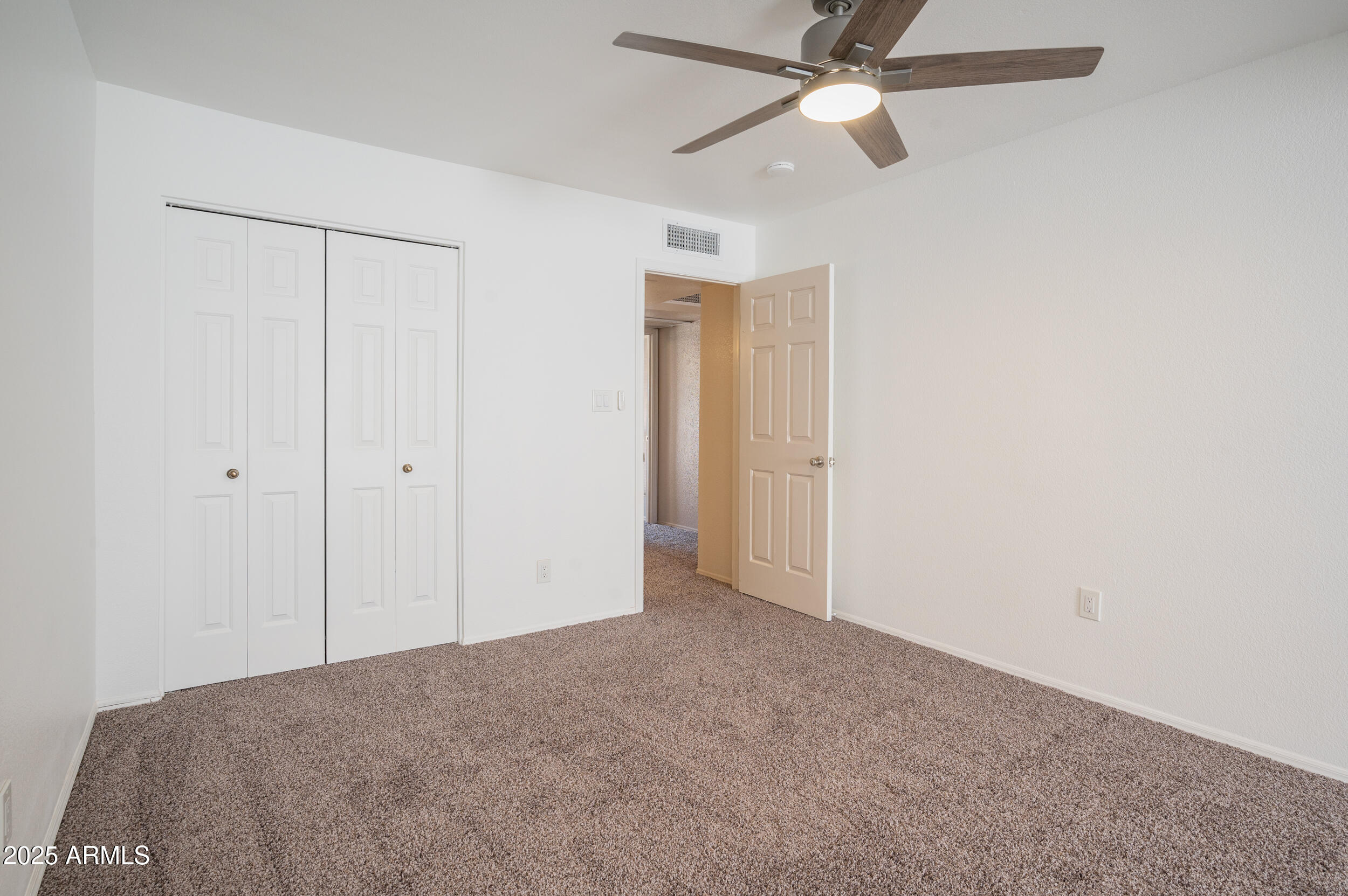 1920 East Maryland Avenue, Unit 31 Phoenix, AZ 85016 - Photo 29 of 43 a view of empty room with a ceiling fan
