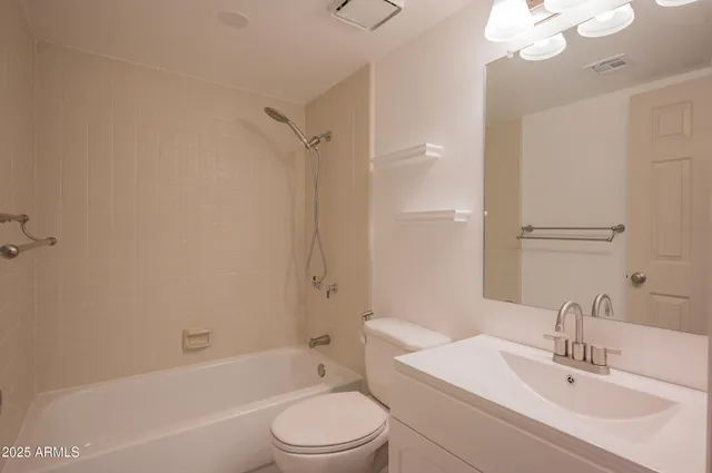 a bathroom with a toilet a sink and a bathtub
