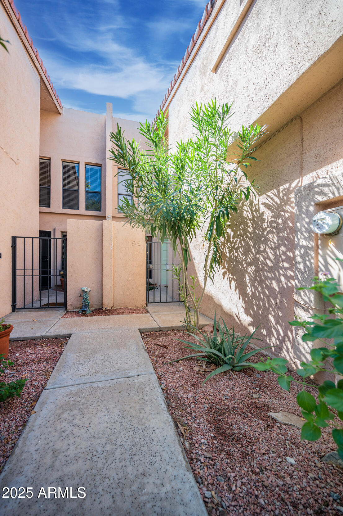 1920 East Maryland Avenue, Unit 31 Phoenix, AZ 85016 - Photo 3 of 43 a front view of a house with garden