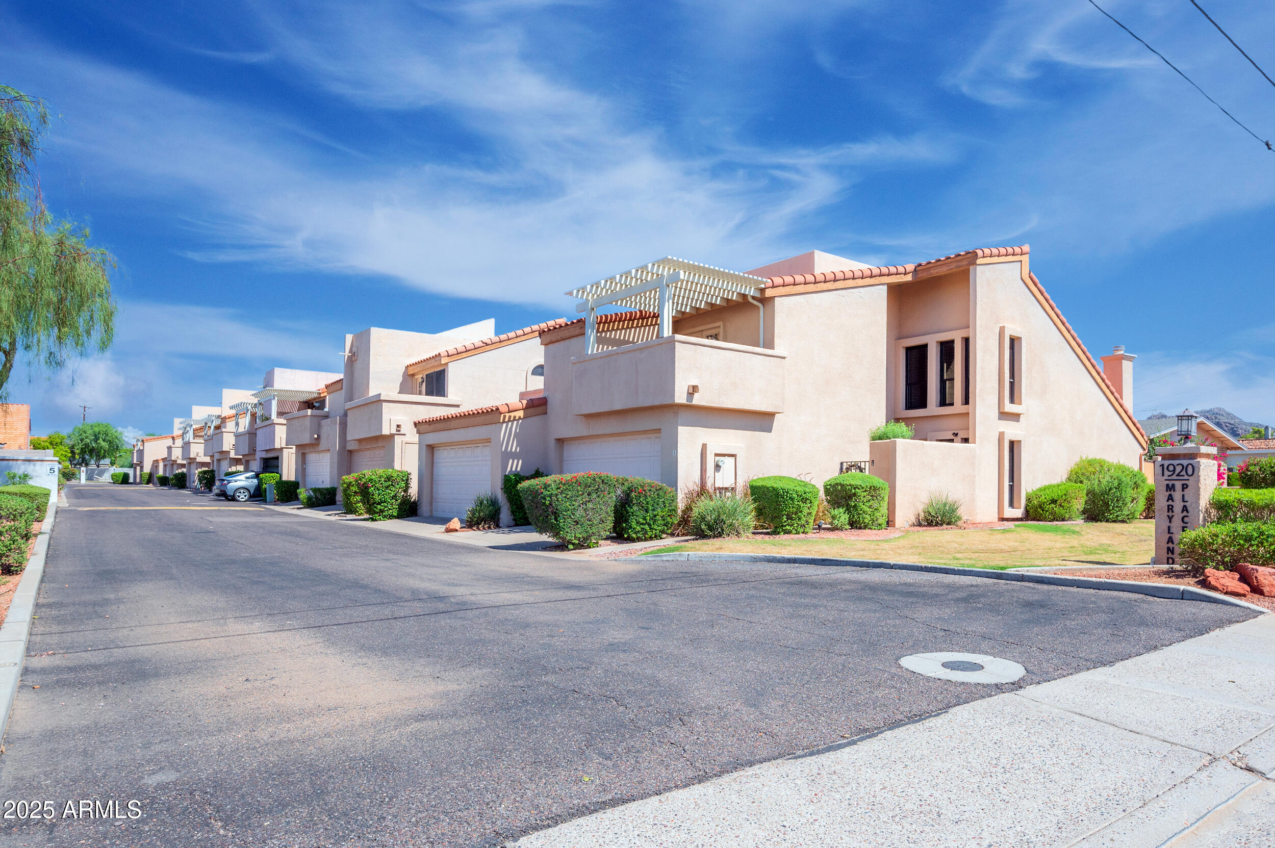 1920 East Maryland Avenue, Unit 31 Phoenix, AZ 85016 - Photo 41 of 43 a front view of a house with a yard and a garage