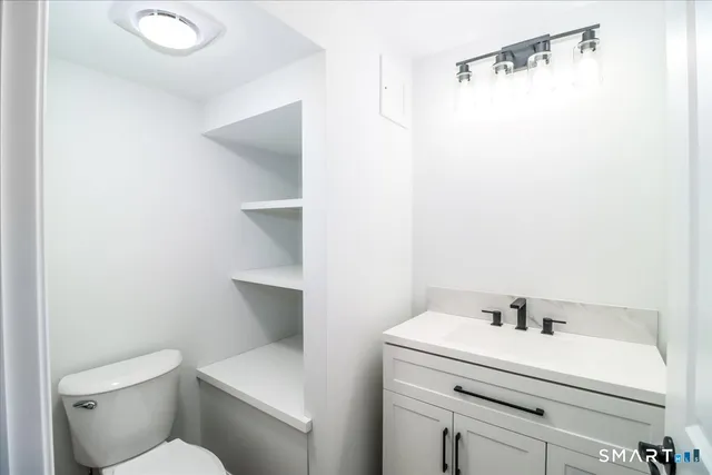 a view of backyard with wooden fence