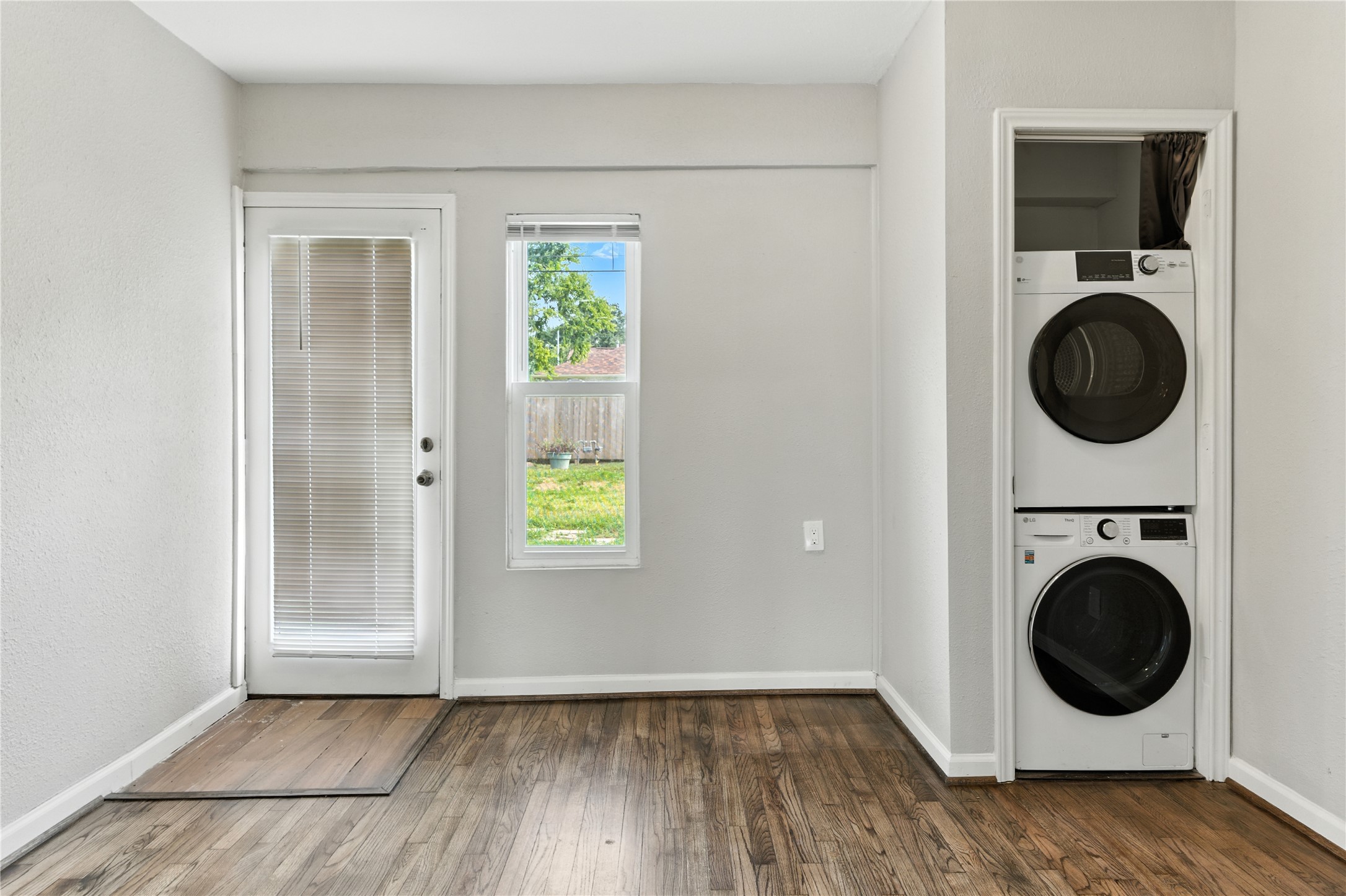 3863 Arbor Street Houston, TX 77004 - Photo 14 of 16 a view of a hallway with washer and dryer