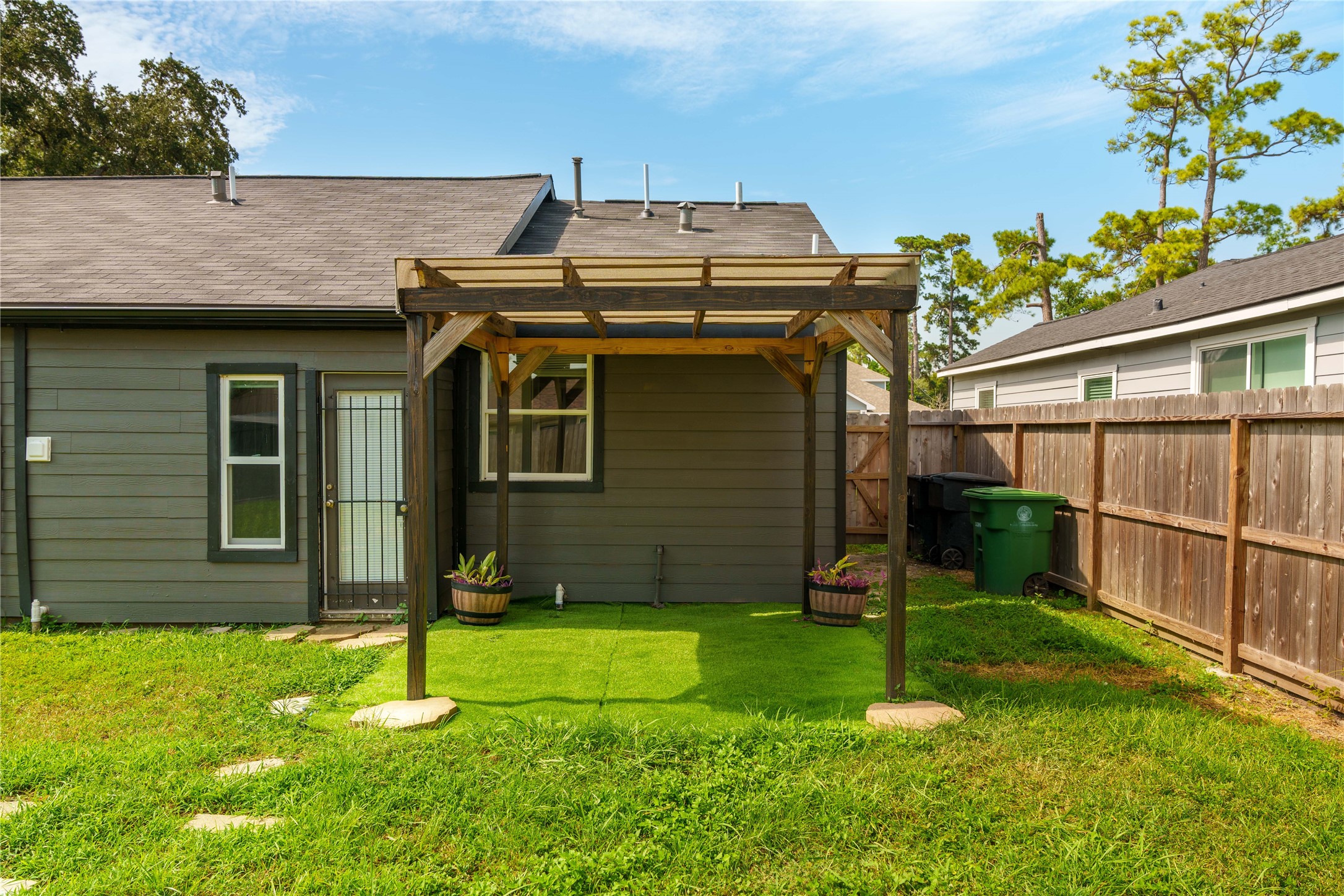 3863 Arbor Street Houston, TX 77004 - Photo 15 of 16 a view of a house with a backyard