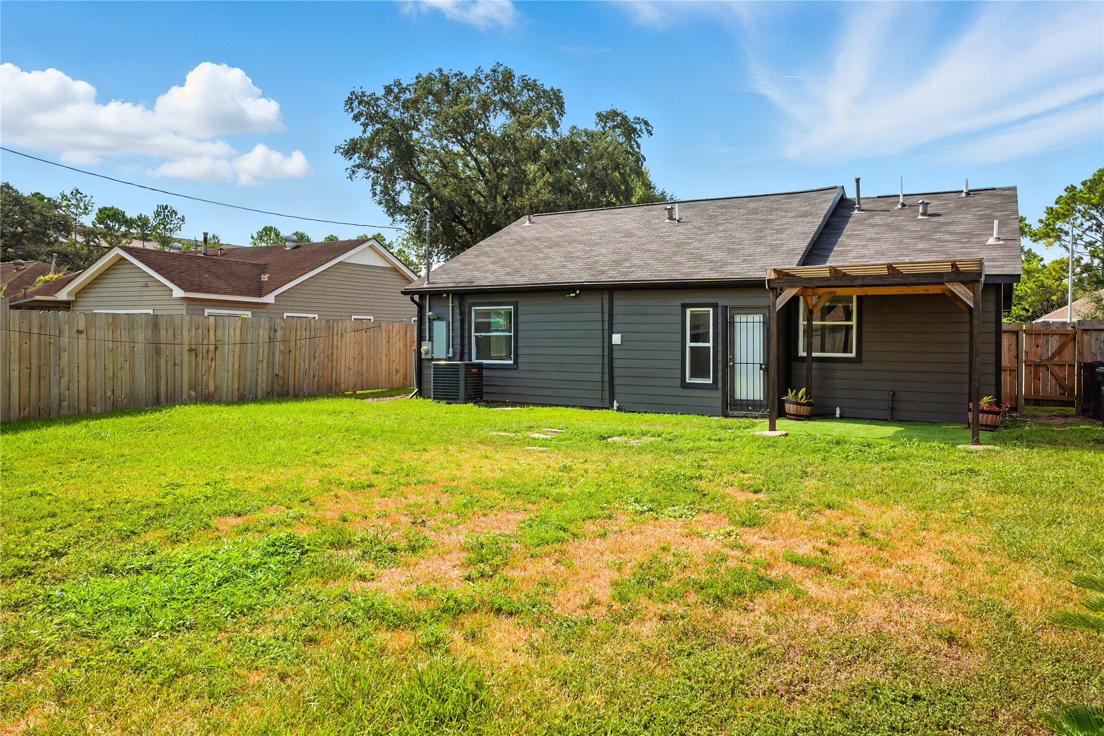 3863 Arbor Street Houston, TX 77004 - Photo 16 of 16 a front view of house with yard and green space