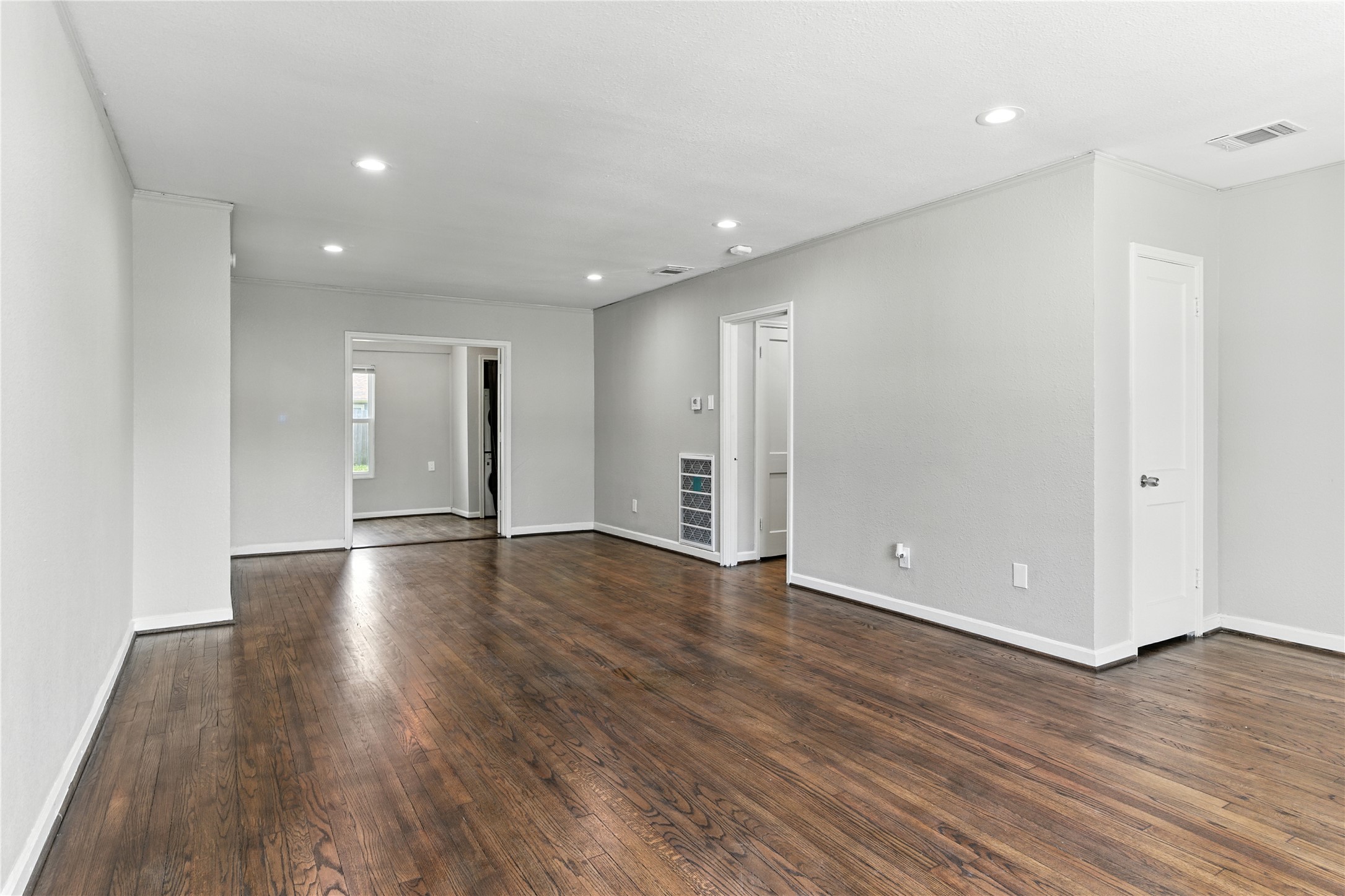 3863 Arbor Street Houston, TX 77004 - Photo 2 of 16 a view of an empty room with wooden floor and closet