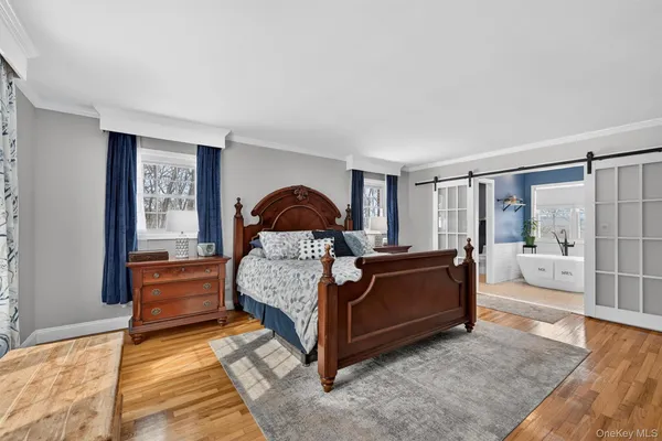 a living room with a bed furniture and a window