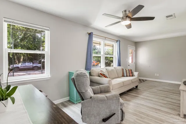 a room with a bed and a mirror