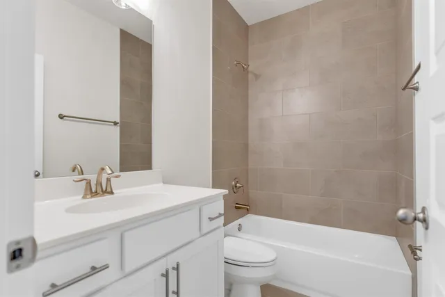a bathroom with a sink toilet and bathtub