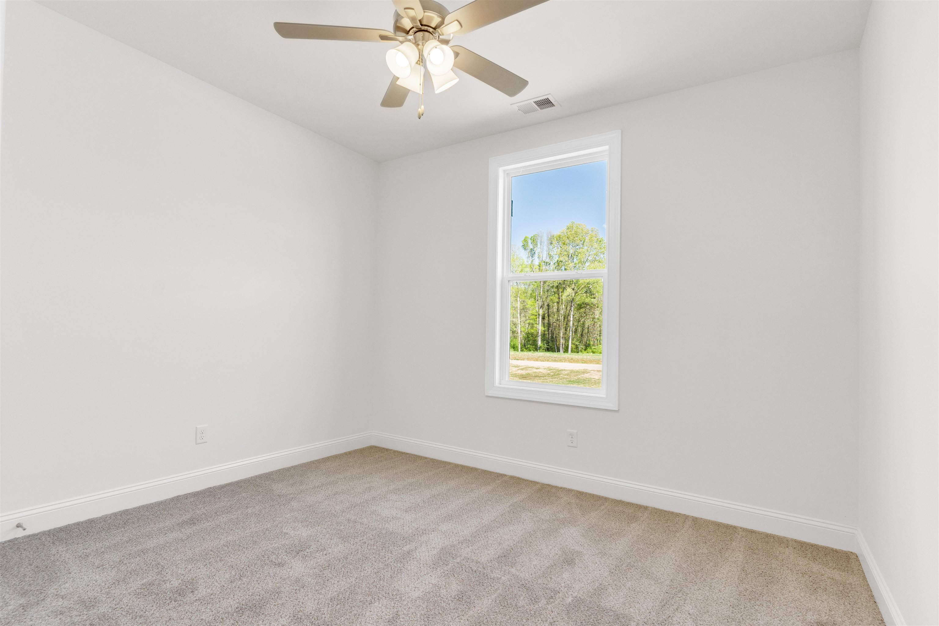 395 Centerline Roper Loop Byhalia, MS 38611 - Photo 13 of 23 an empty room with a window and a fan