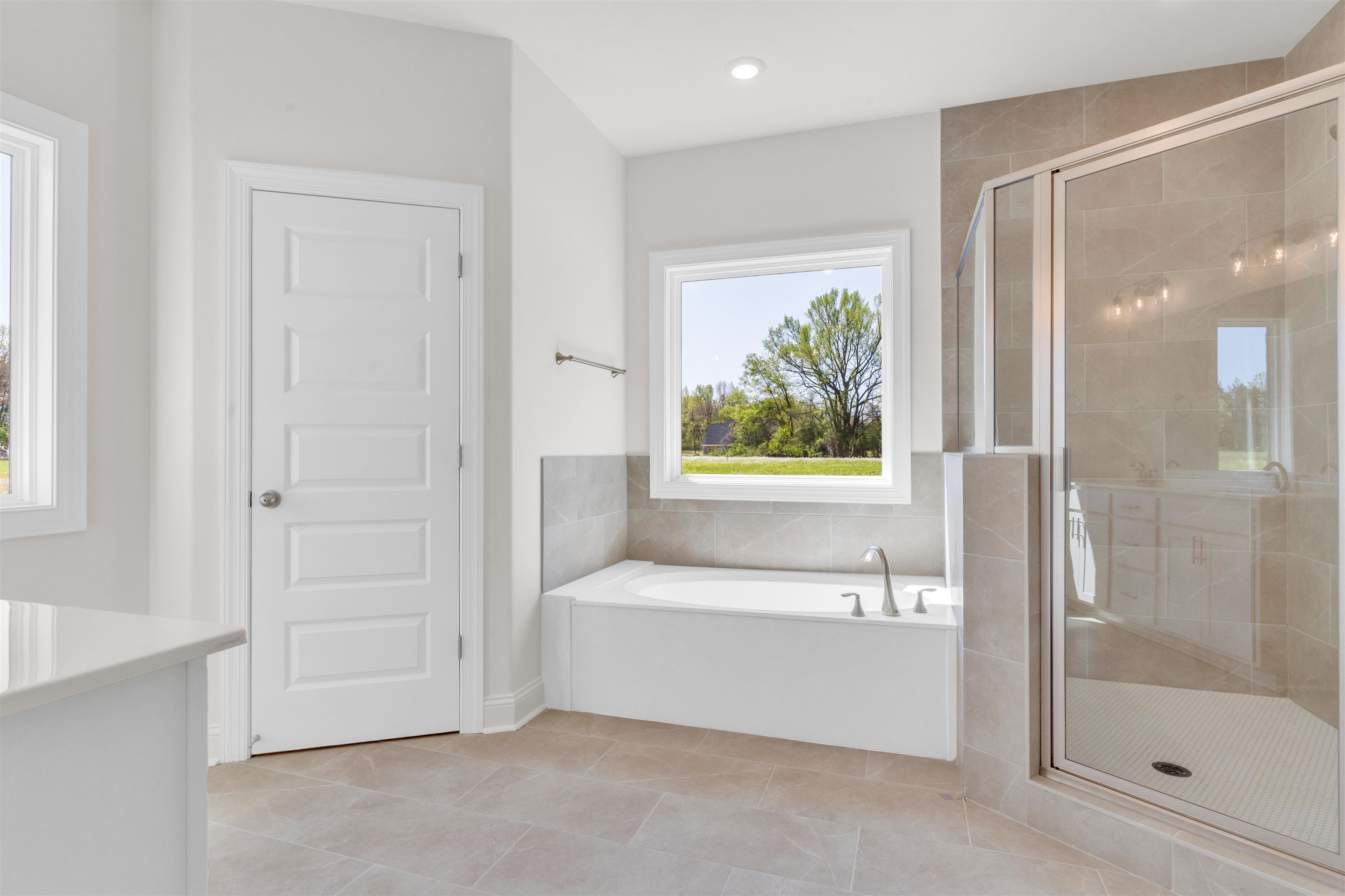 395 Centerline Roper Loop Byhalia, MS 38611 - Photo 15 of 23 a bathroom with a bathtub and a shower