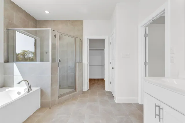 a bathroom with a bathtub and a sink