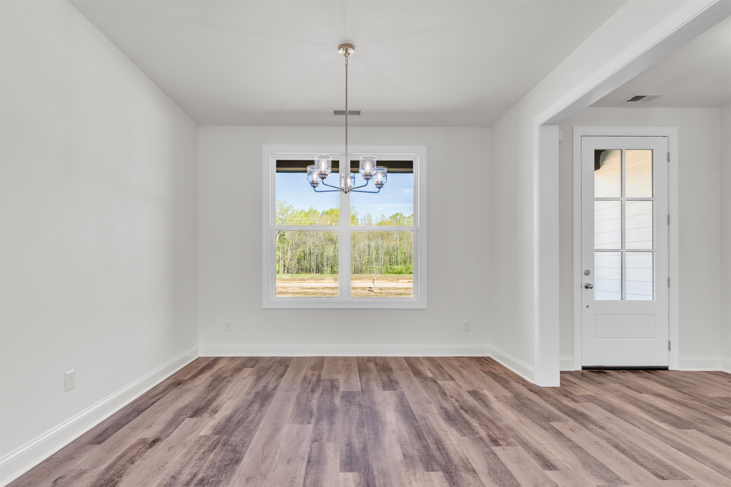 395 Centerline Roper Loop Byhalia, MS 38611 - Photo 5 of 23 en empty room with window and wooden floor