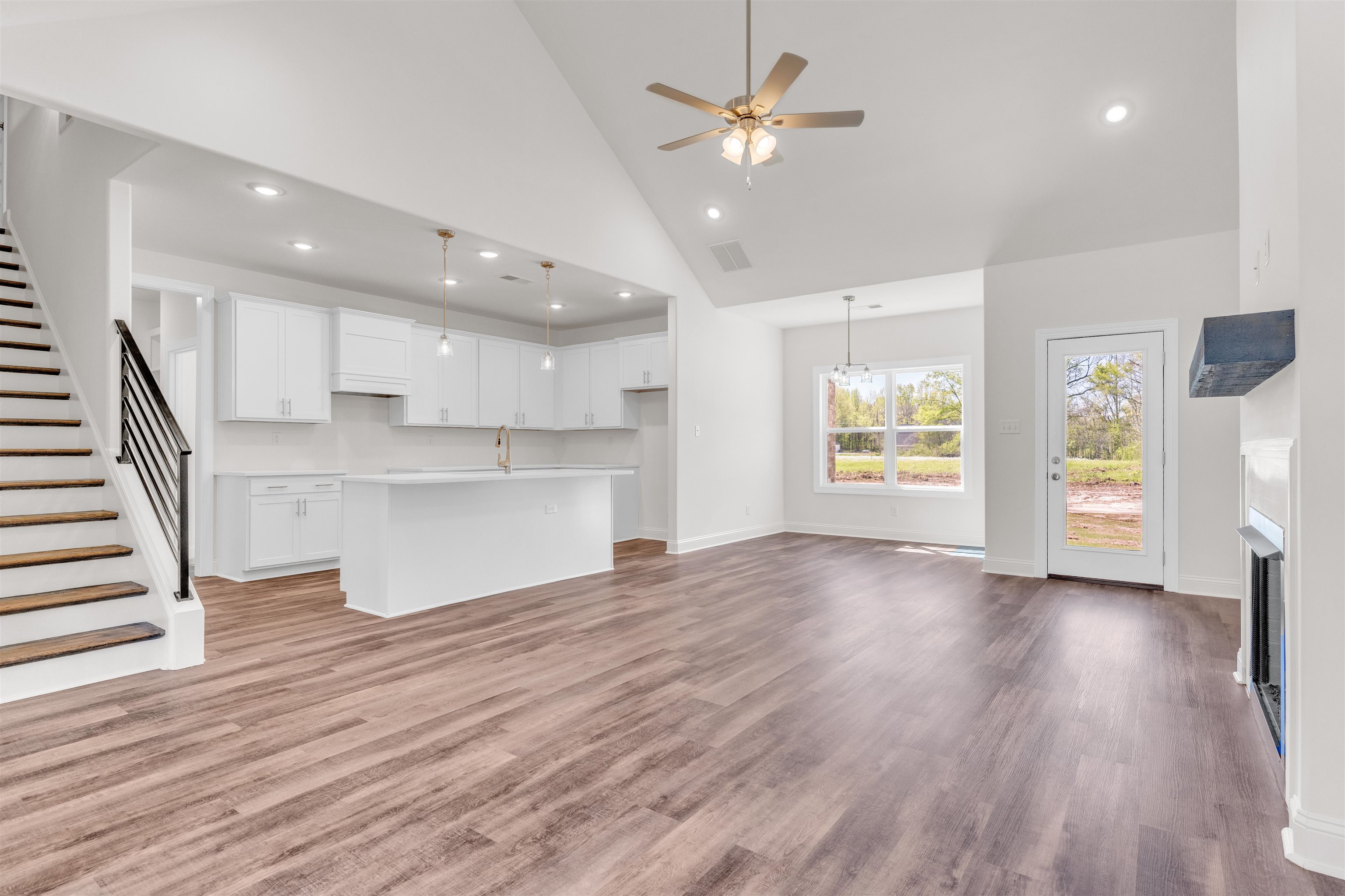395 Centerline Roper Loop Byhalia, MS 38611 - Photo 6 of 23 a view of an empty room with wooden floor and a window