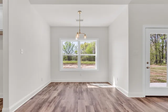 an empty room that has a window in it