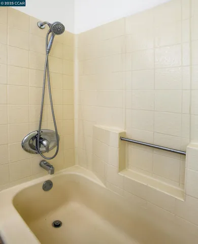 a bathroom with a bath tub