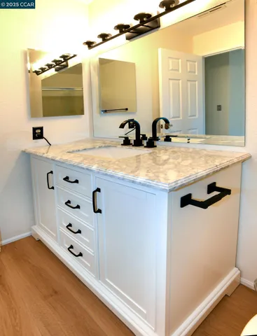 a white toilet sitting next to a bathroom sink