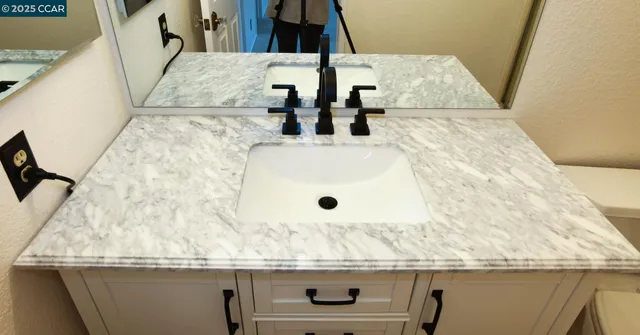 a view of a backyard with sitting area