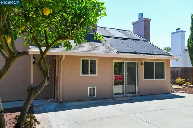 a front view of a house with a large window